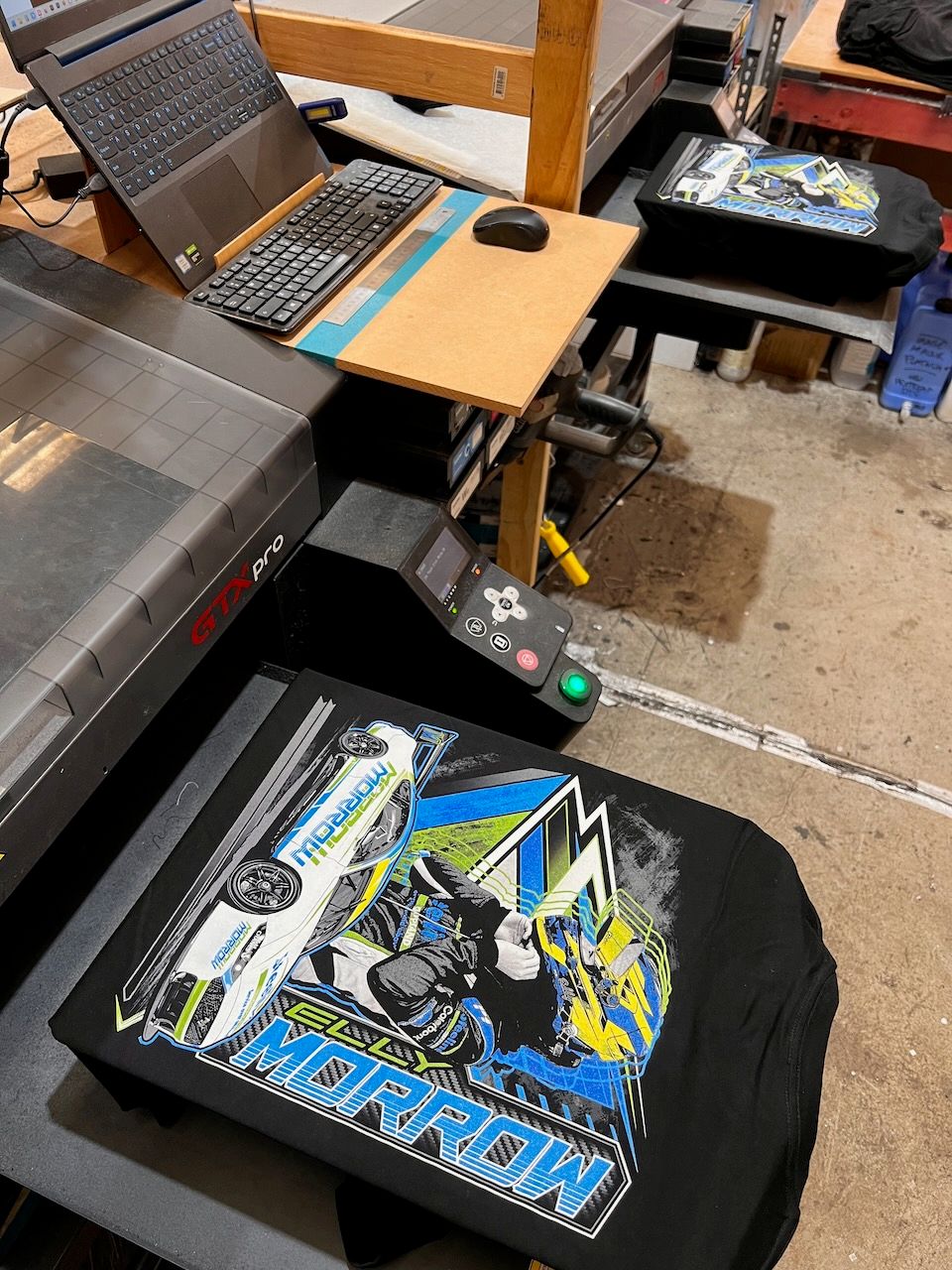 A printed tee on the machine in our workshop