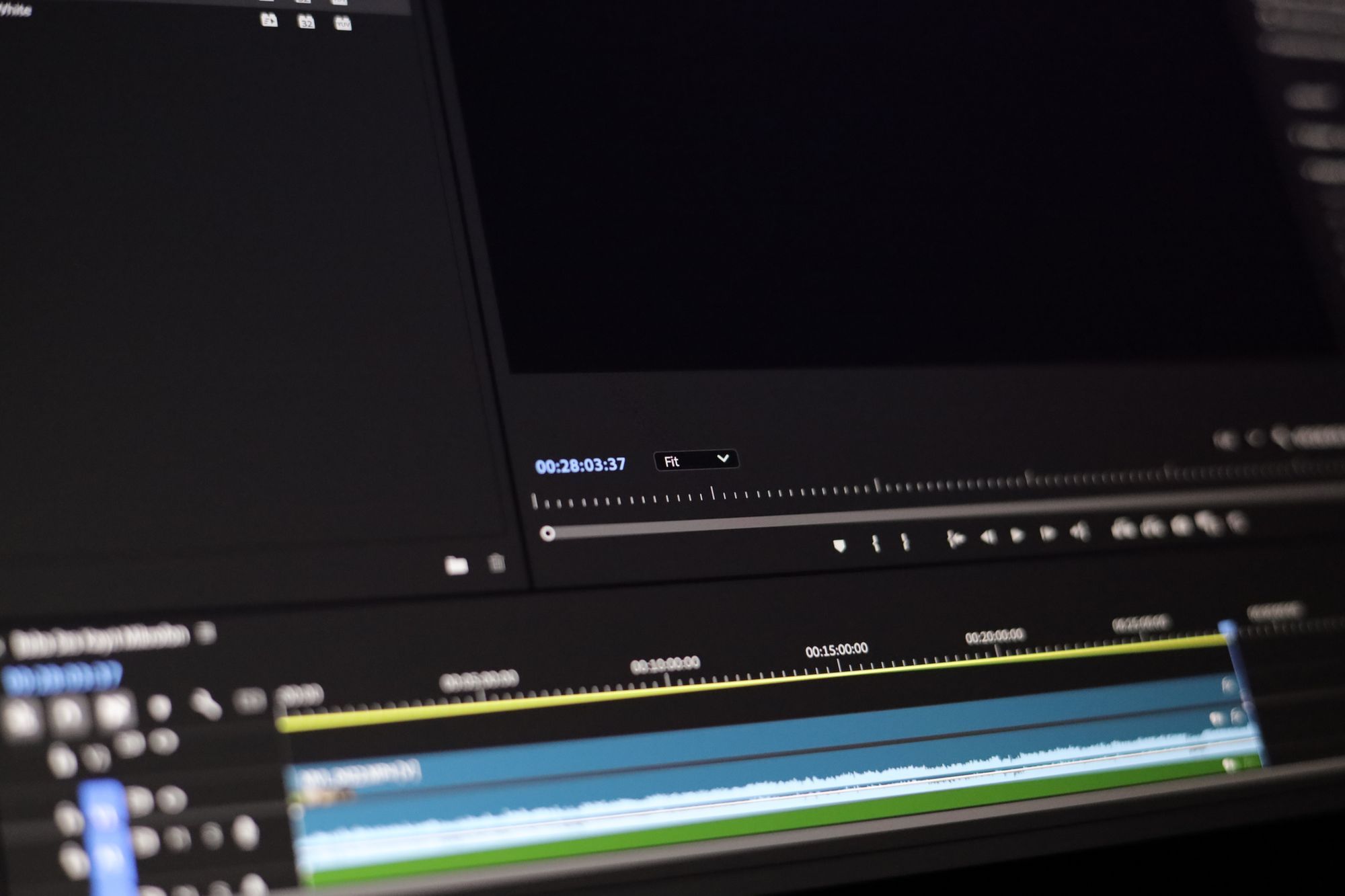 Close-up of video editing software showing a timeline and playback controls