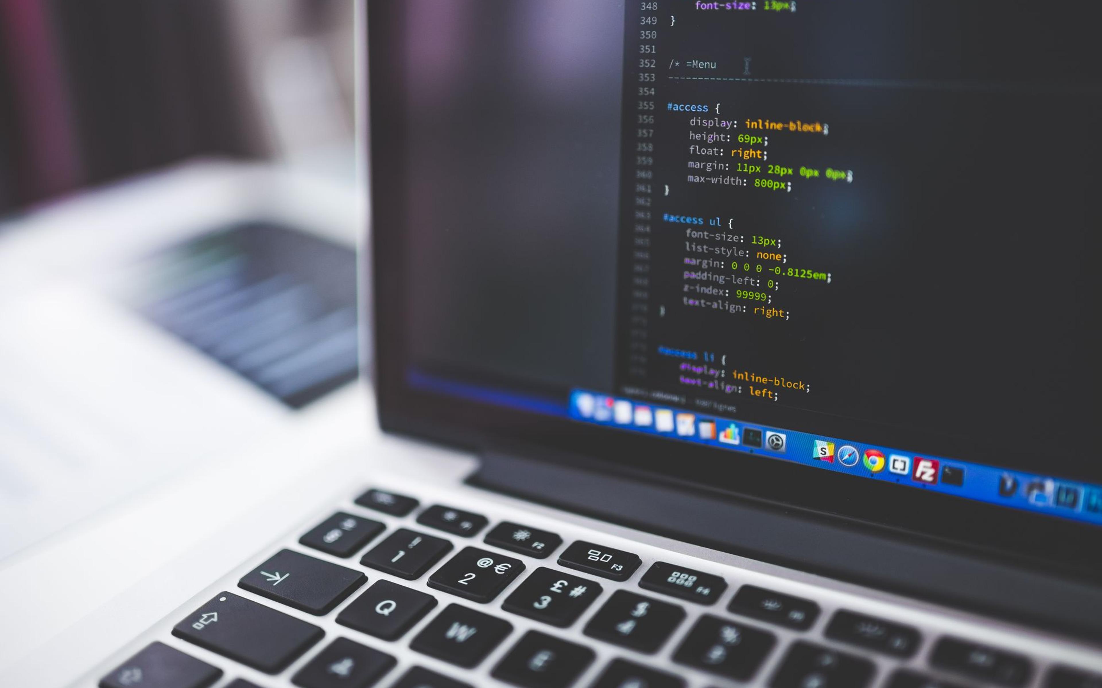 Source code displayed on a laptop