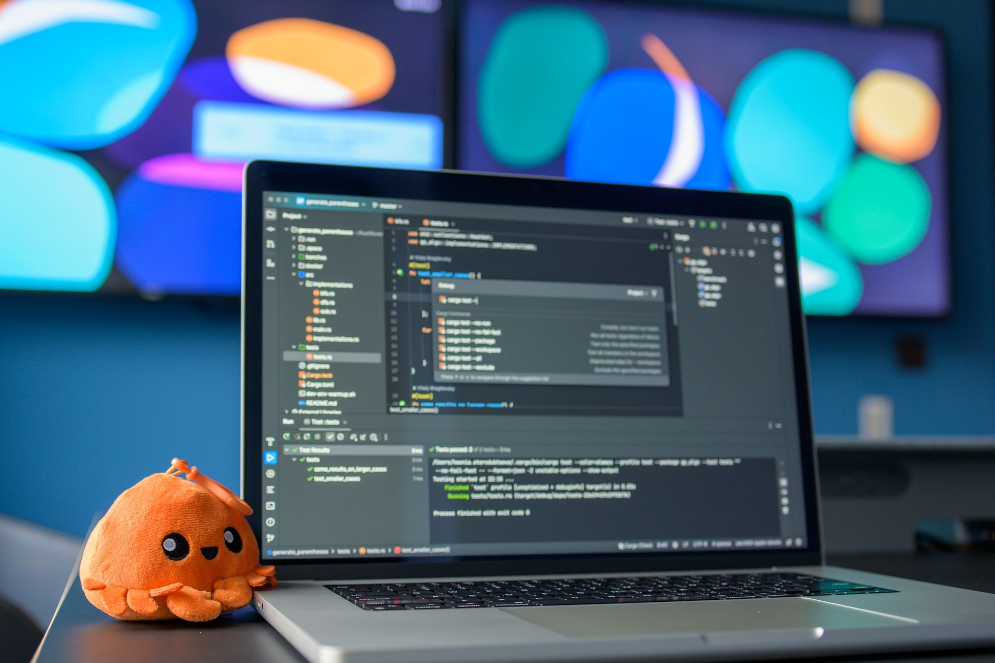 A colourful workspace with code on screen
