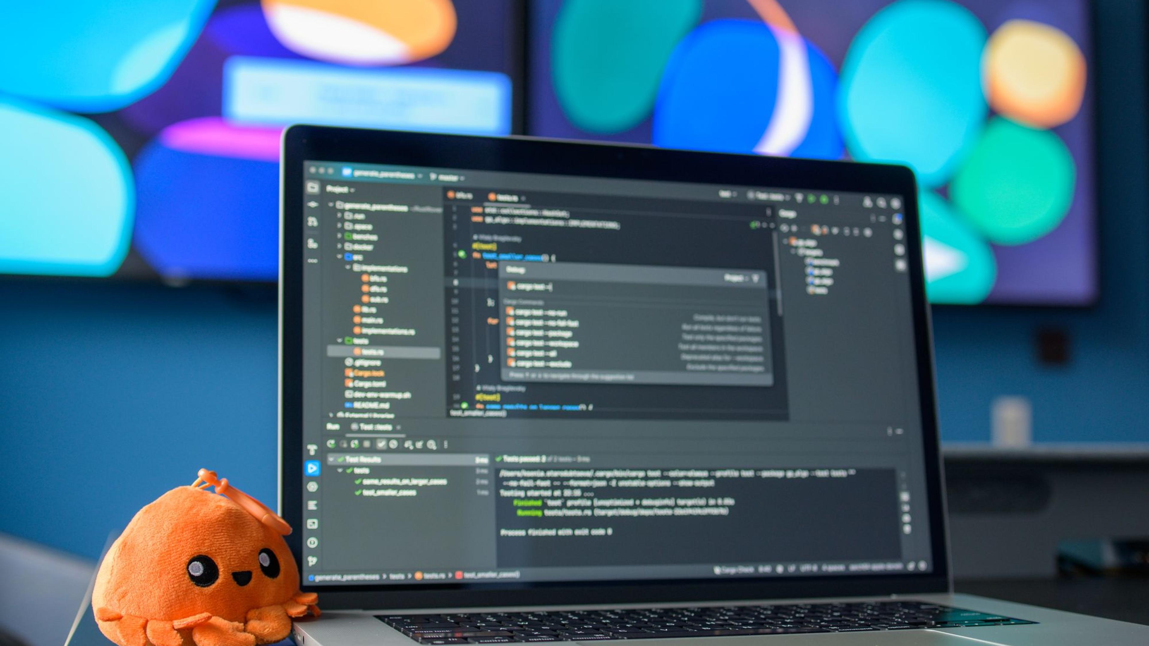 A colourful workspace with code on screen