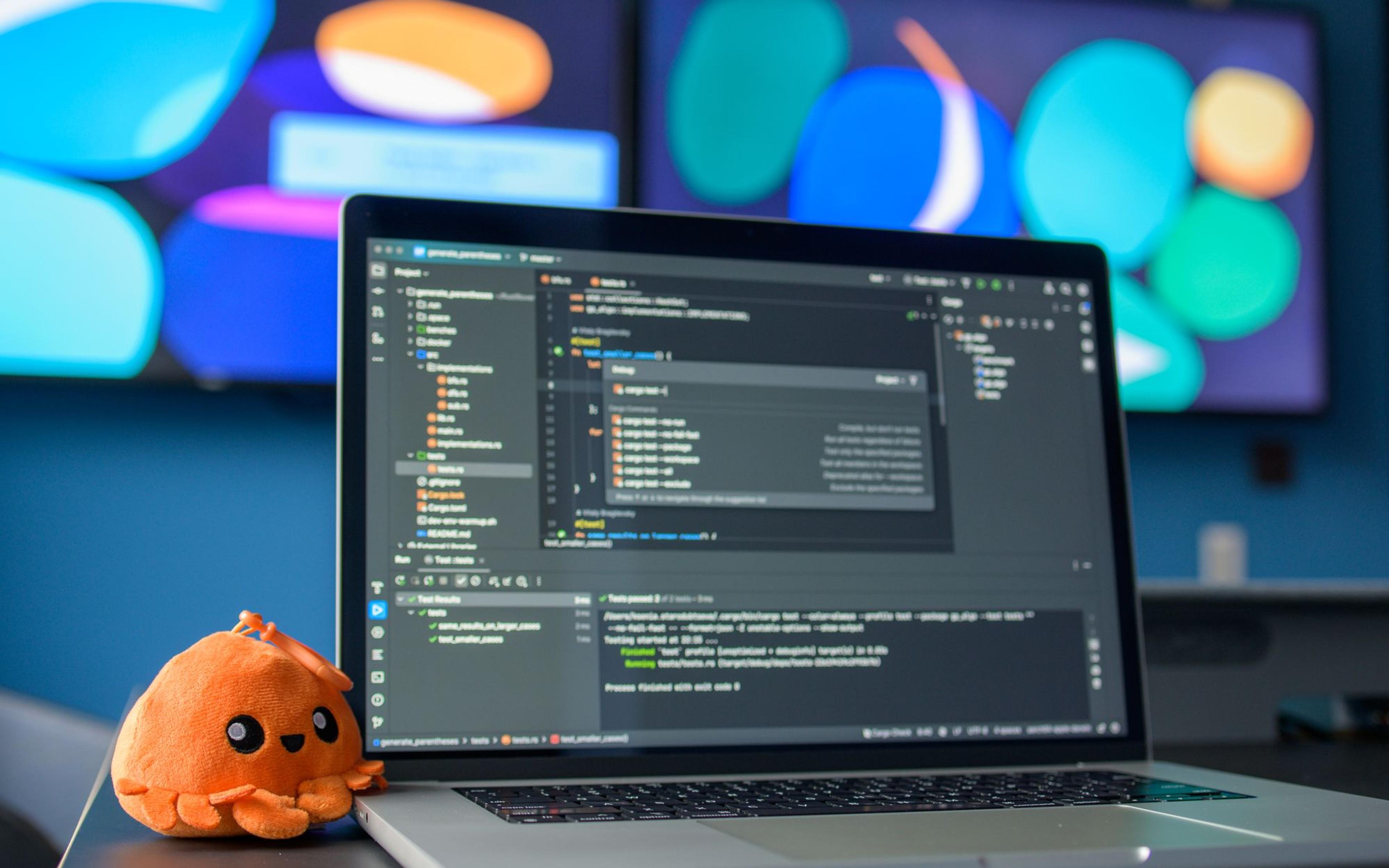 A colourful workspace with code on screen