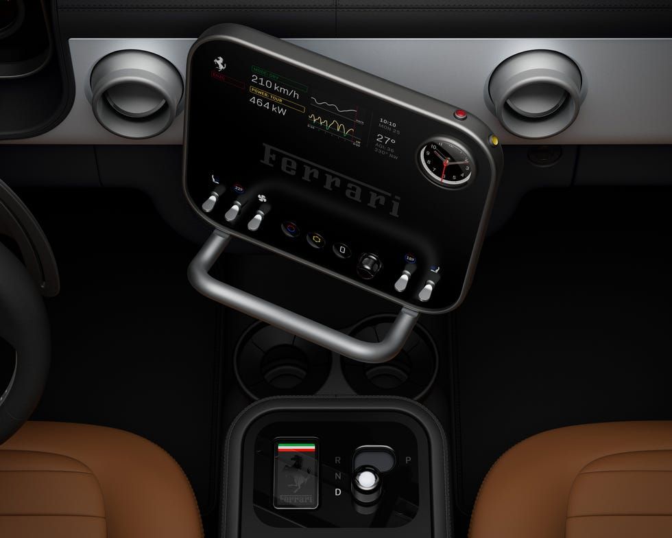 Ferrari Luce interior, central control panel with tilted touchscreen displaying speed and power data, analog clock, physical knobs and levers, tan leather seats, official press image.
