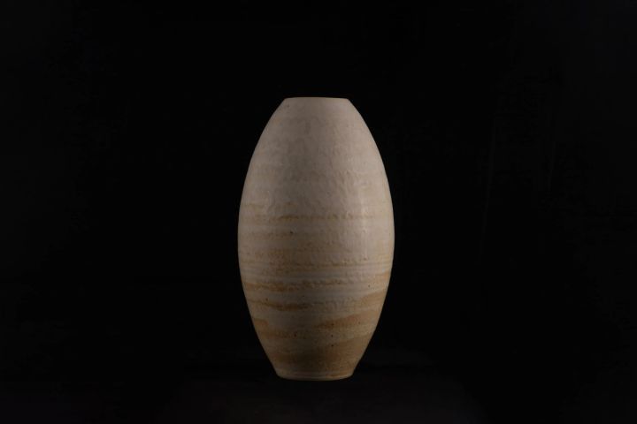 Handmade ceramic vase on a black background