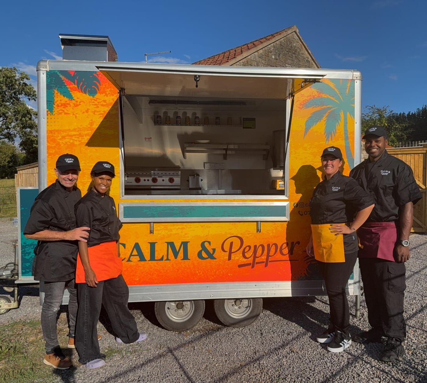 The Calm & Pepper team standing in front of the trailer