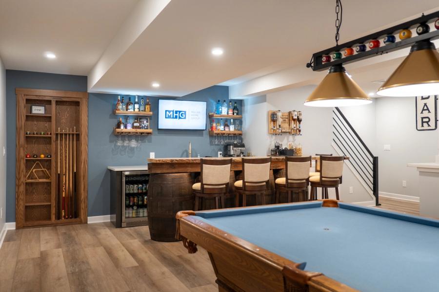Bar and pool table in a finished basement