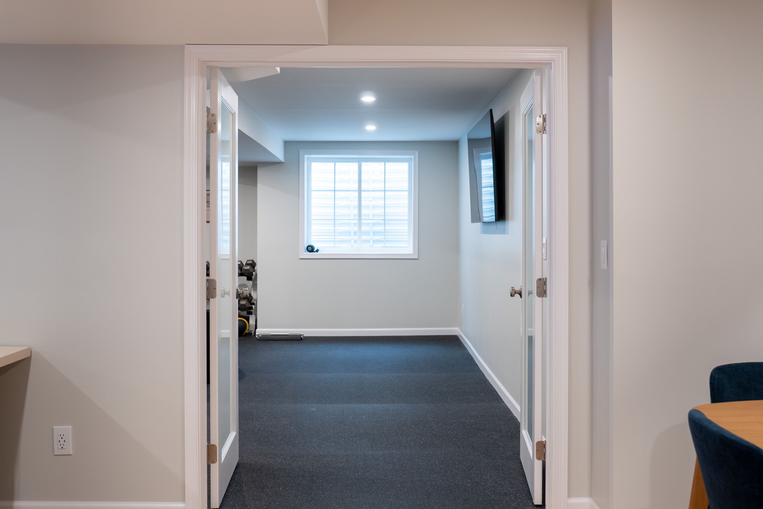 Open french doors leading to the gym