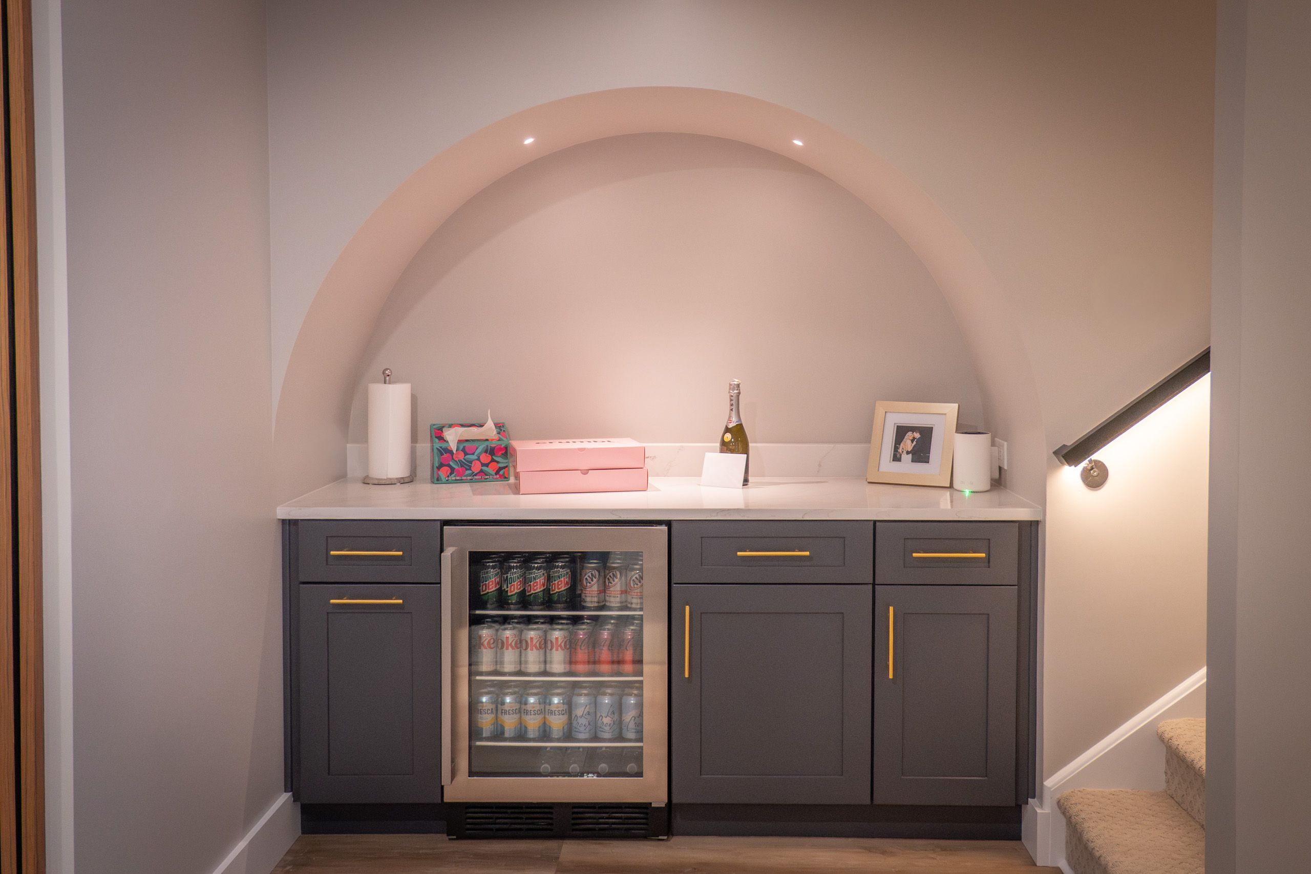 Dry bar with arch over it