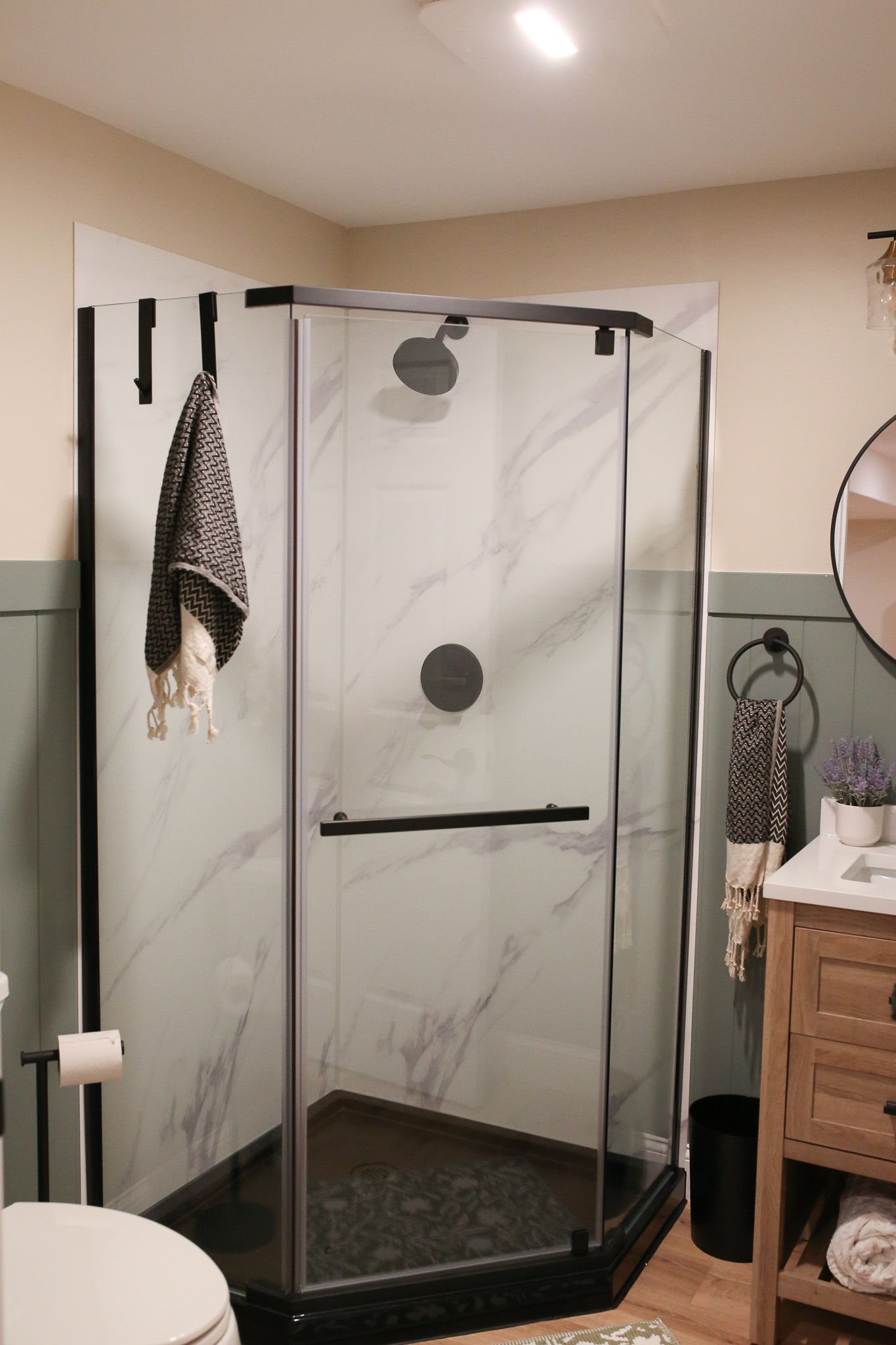 shower in the corner of the bathroom