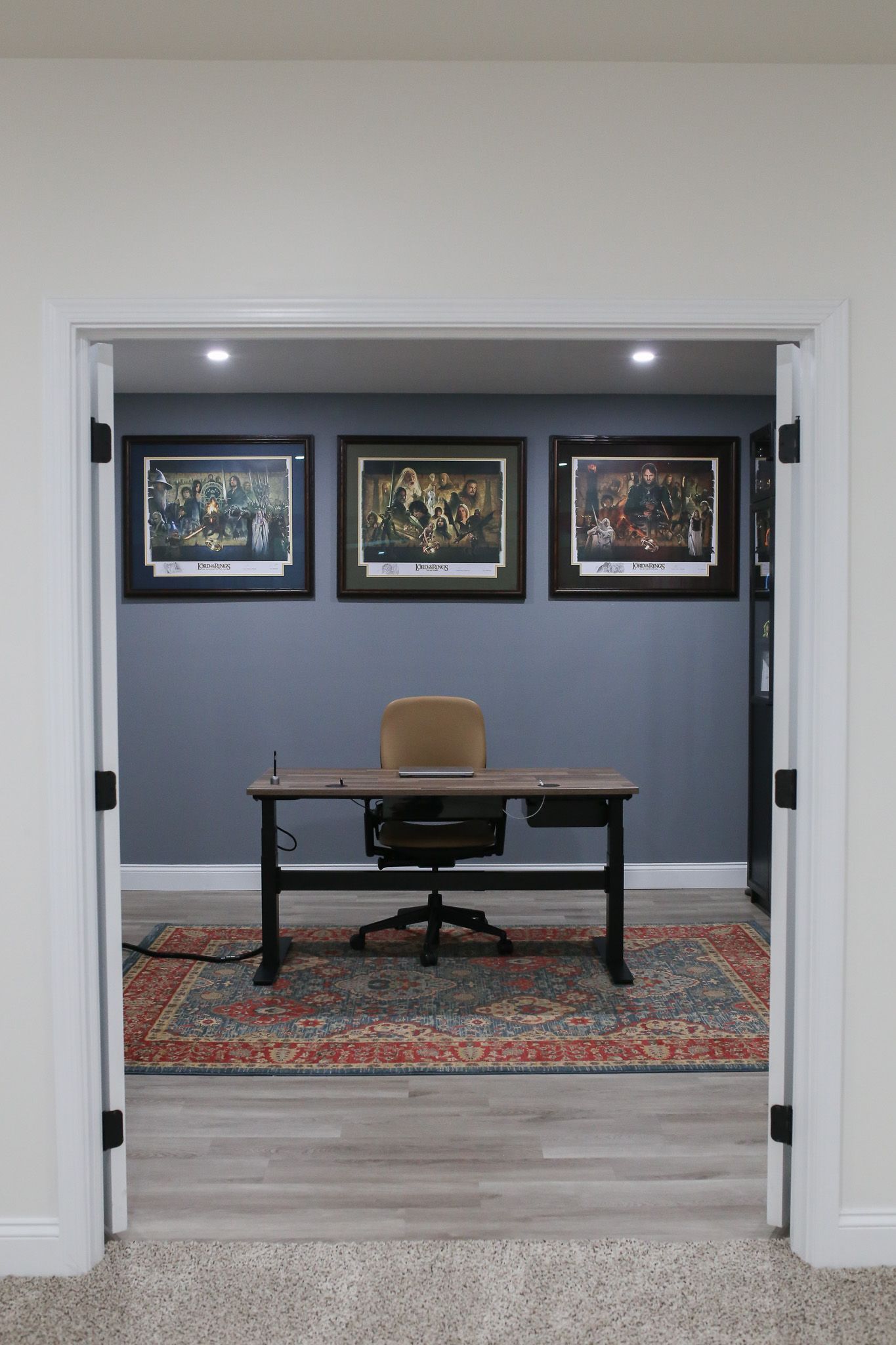 Desk with Lord of the Rings posters behind it