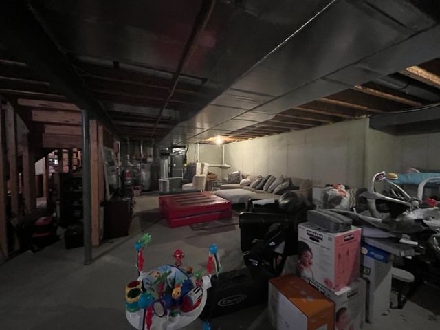 unfinished basement with stuff everywhere