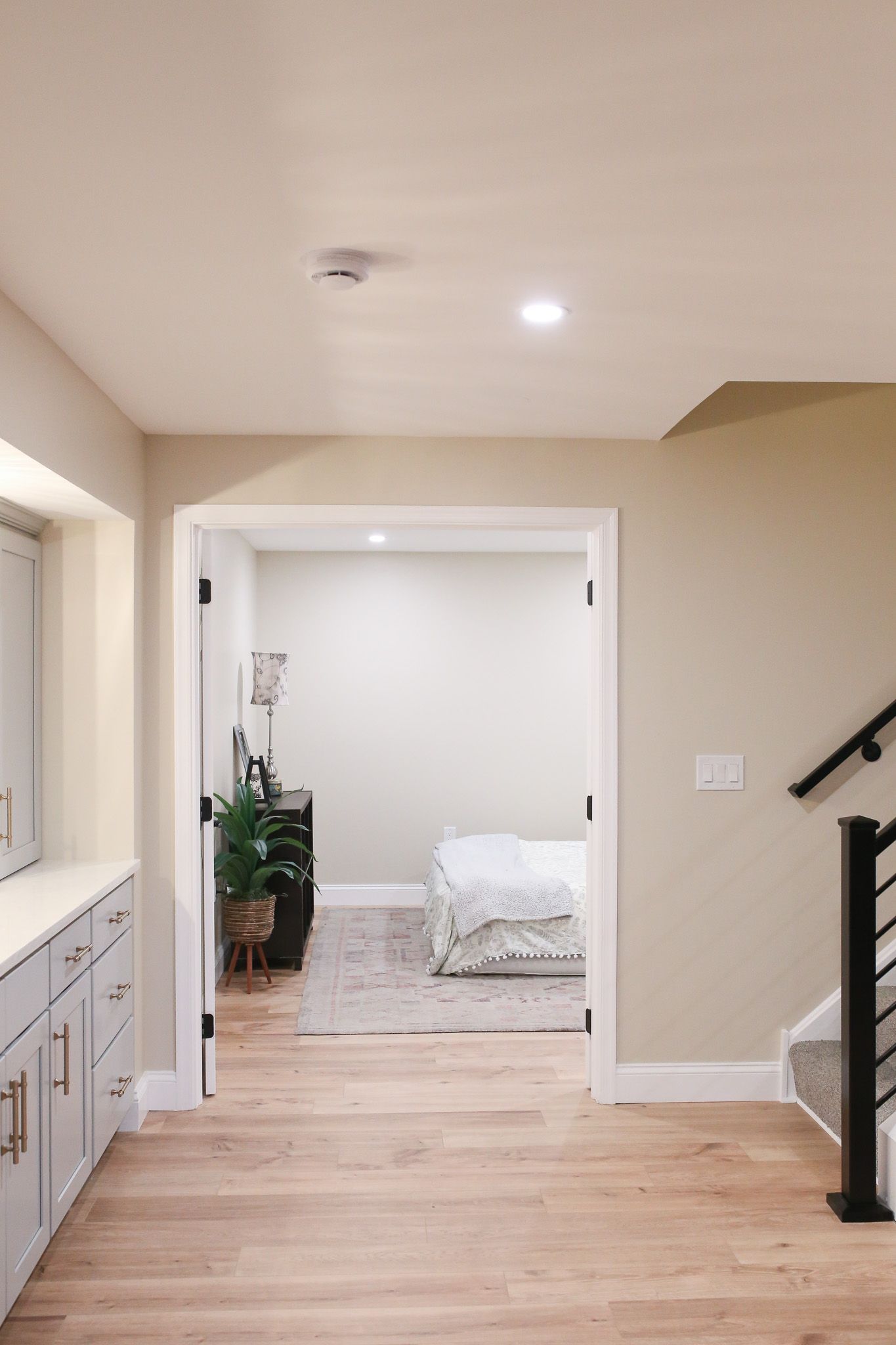 door leading into a bedroom with the foot of the bed visible