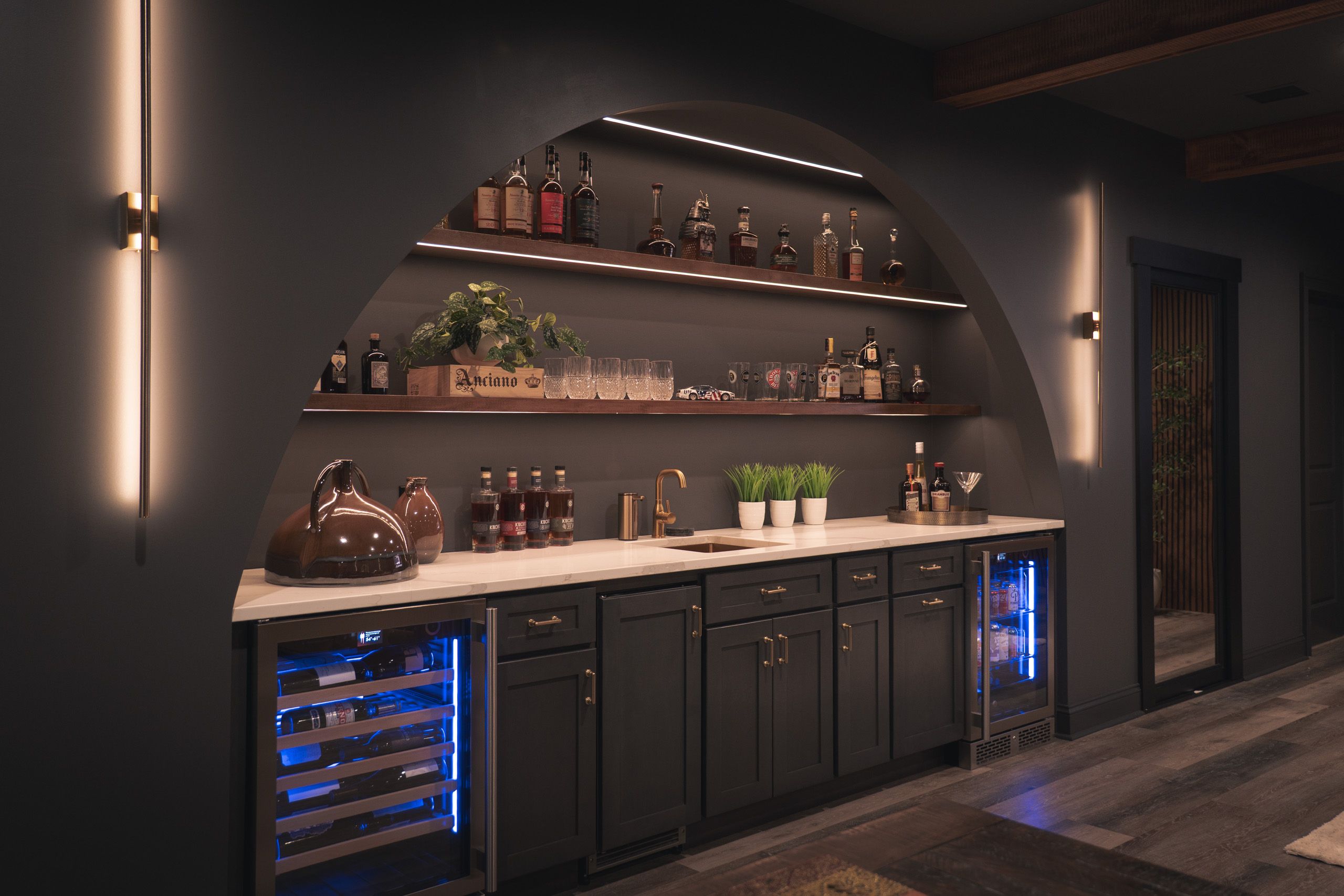 Arched wet bar with floating shelves