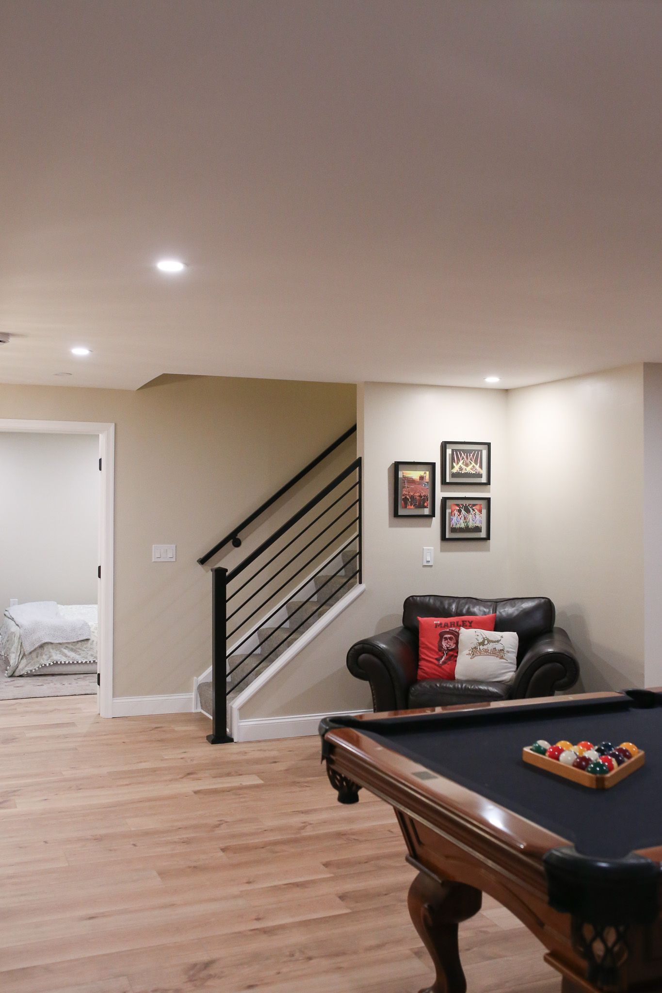 custom block metal railing at the bottom of the basement stairs