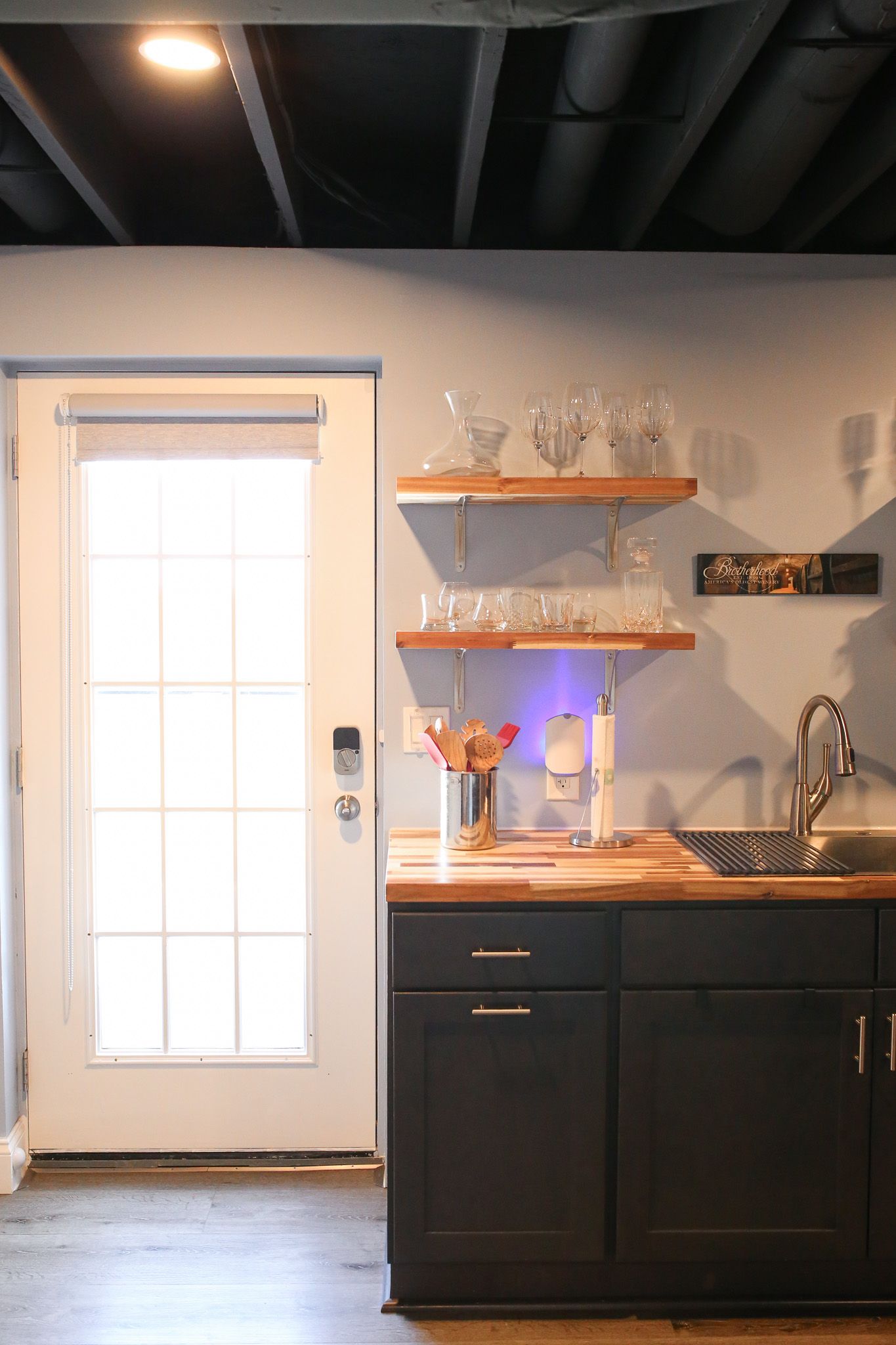 Fantastic wetbar with a butcher-block counter top