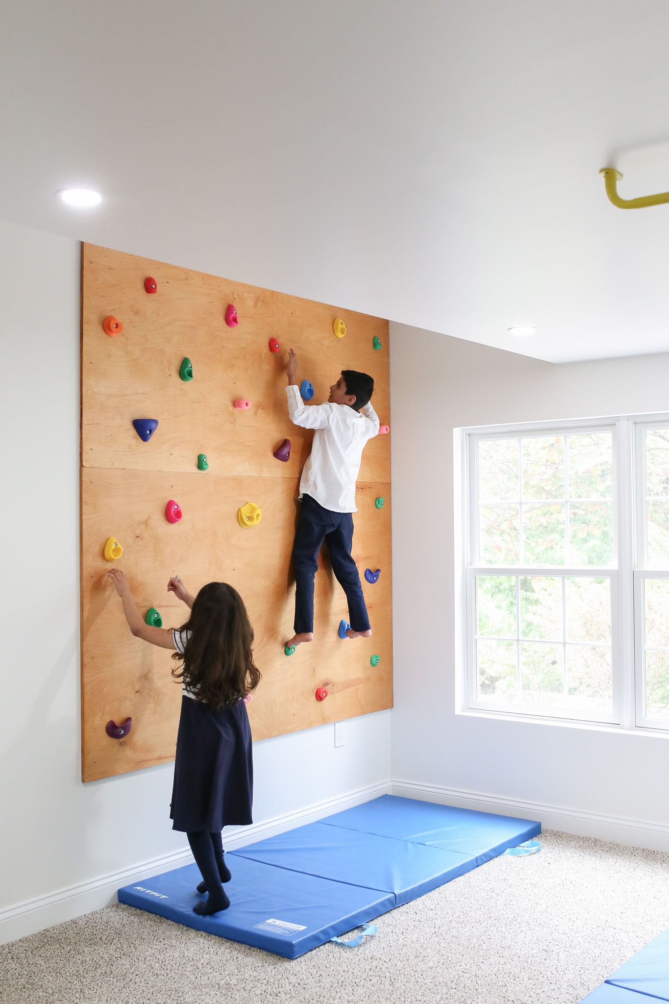 Kids climbing the rock wall