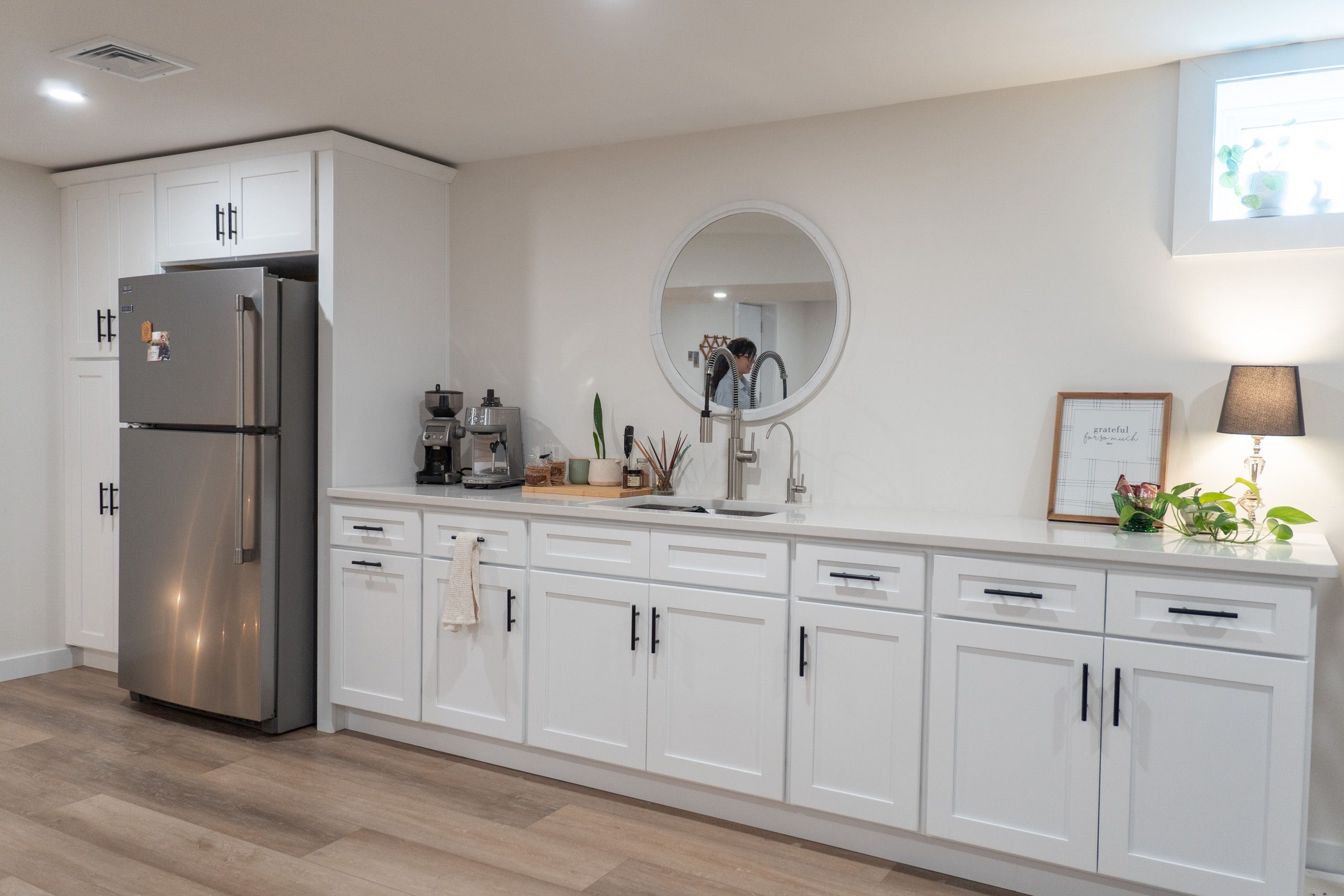 Wet bar with white cabinets