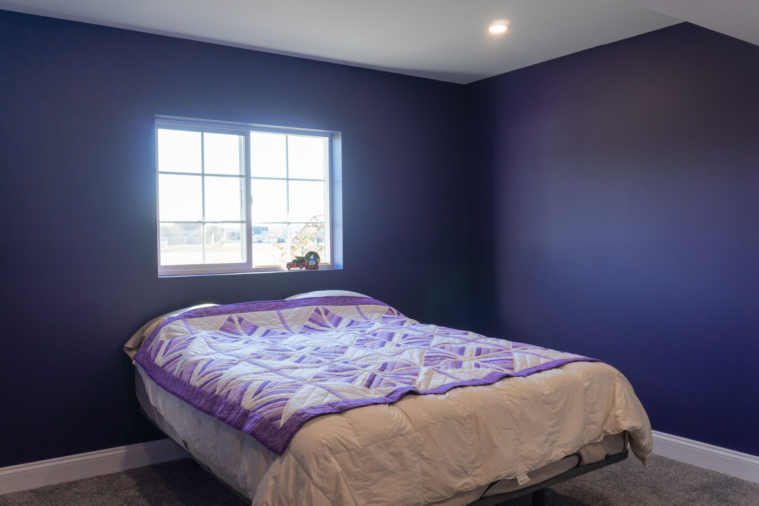 Bedroom with purple walls