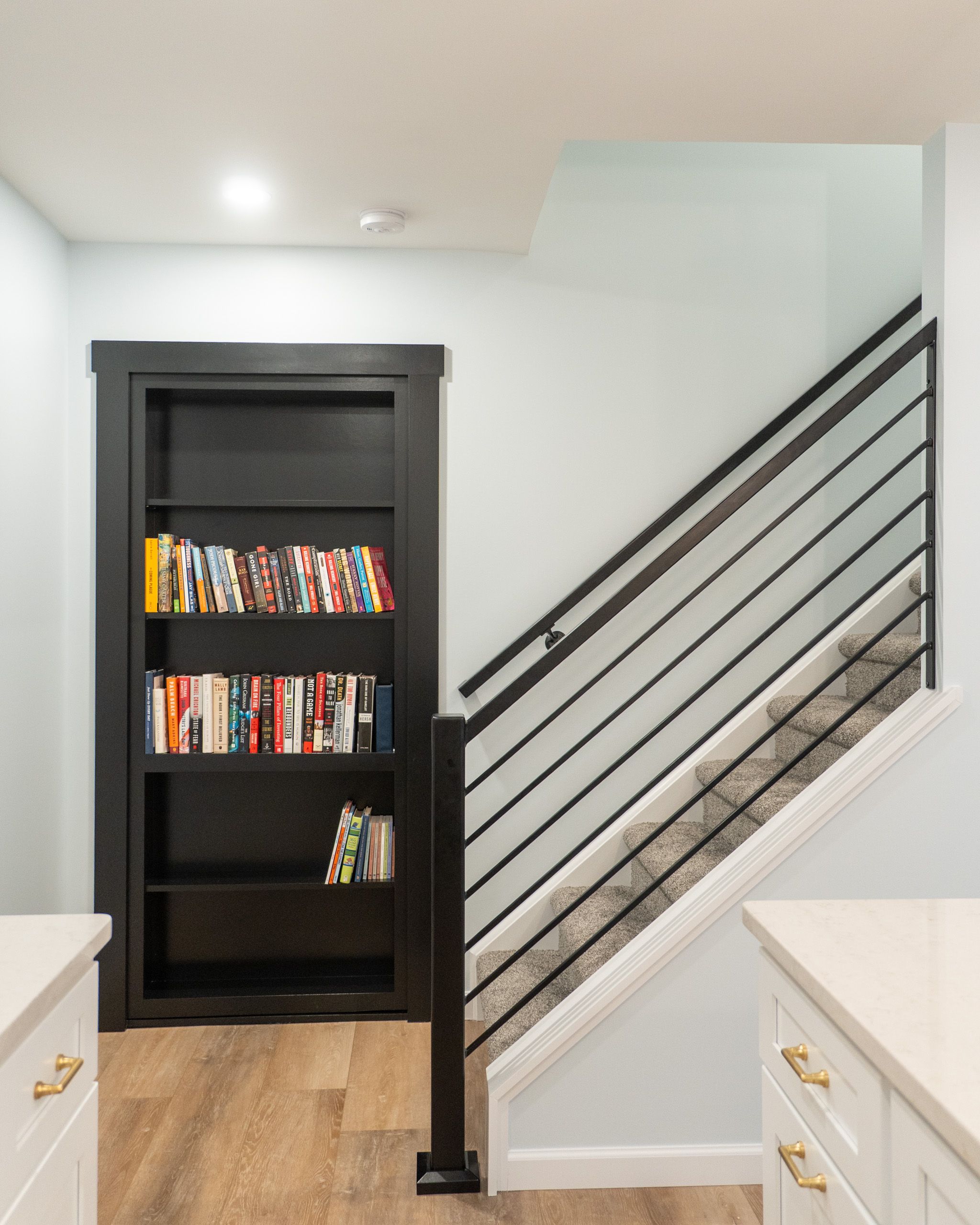 Stairs and hidden bookshelf door