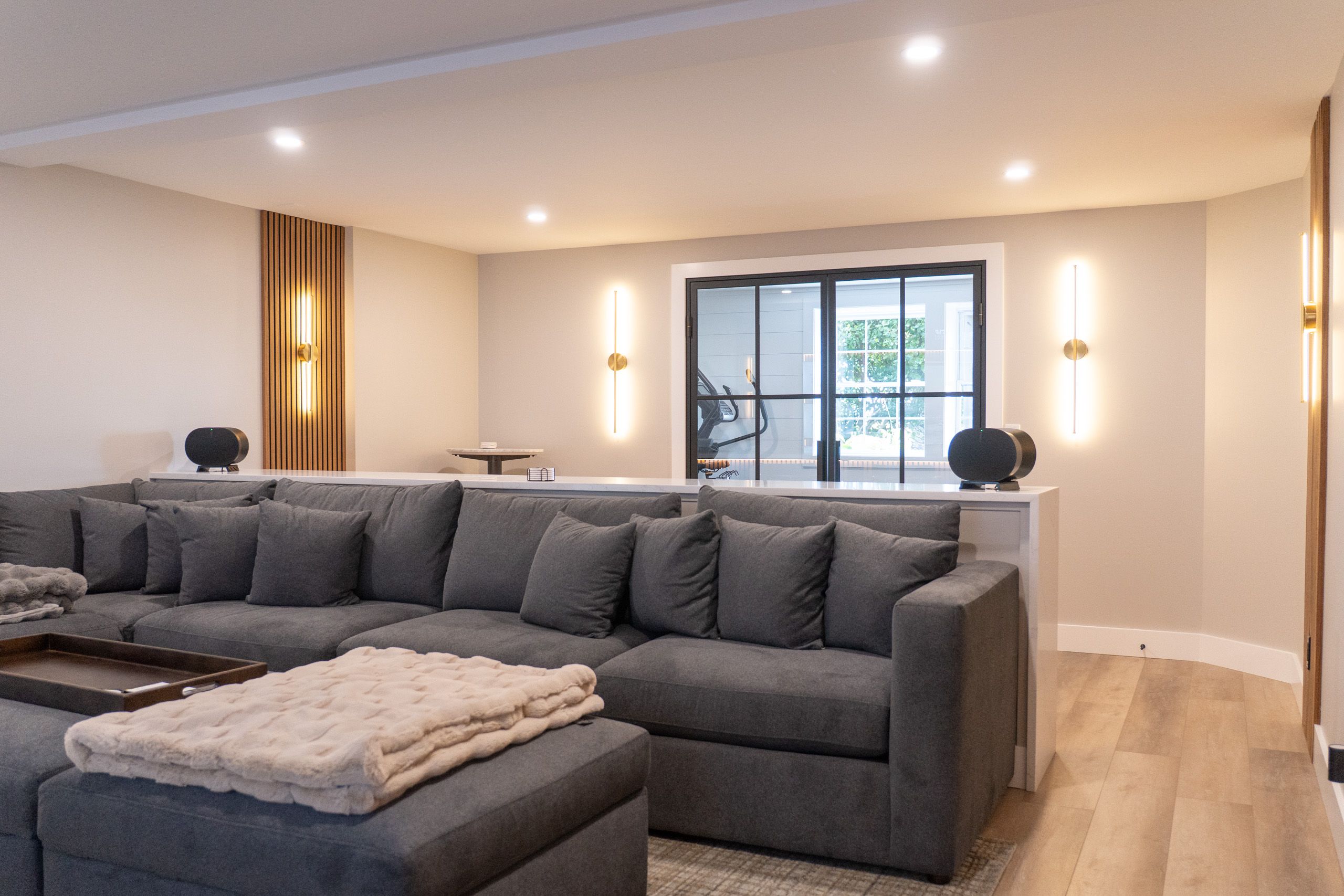 Couch with glass door behind it