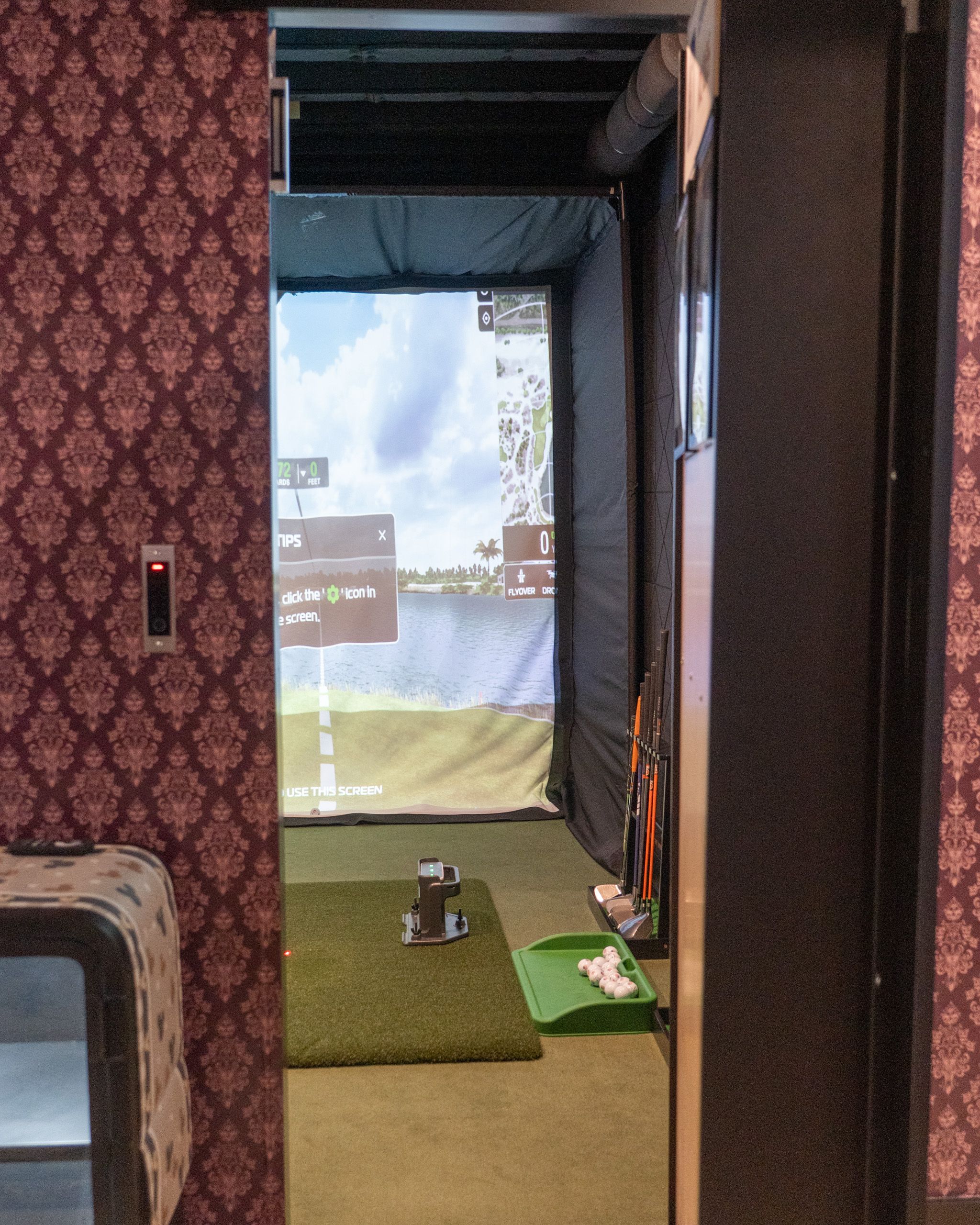 Hidden door leading to the golf sim room