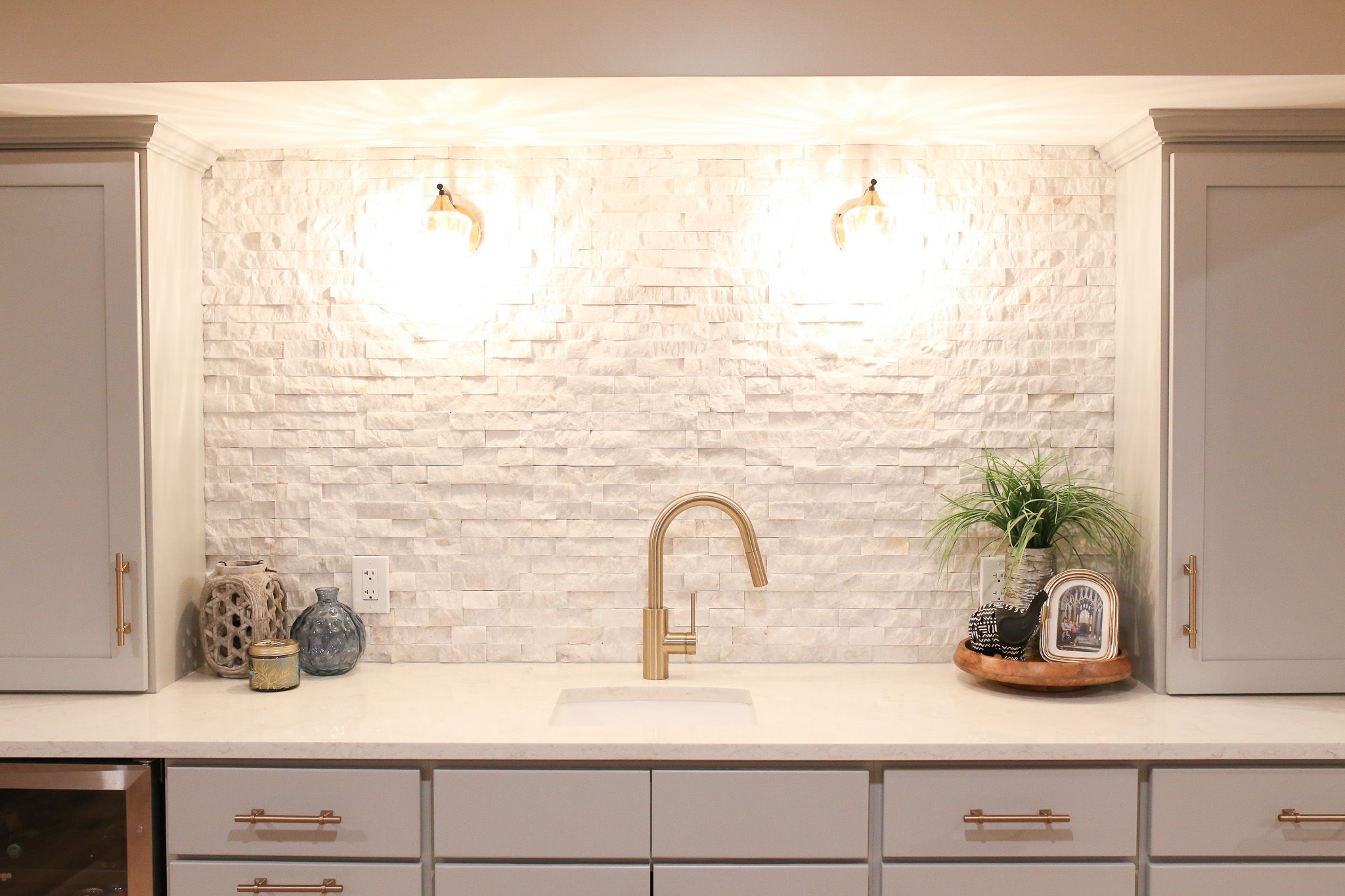 Wet bar with Misty Grey cabinets from CNC Cabinetry’s Luxor line