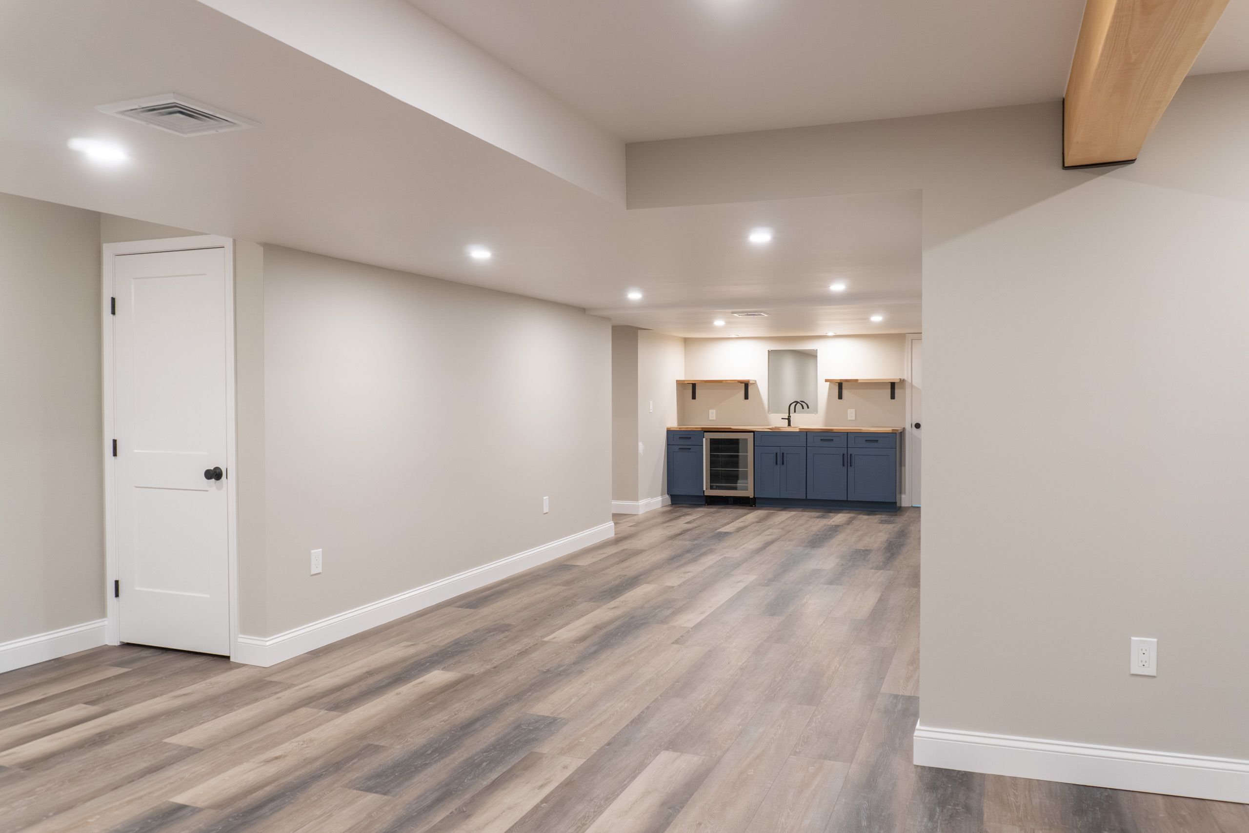 General living area with wet bar in the background