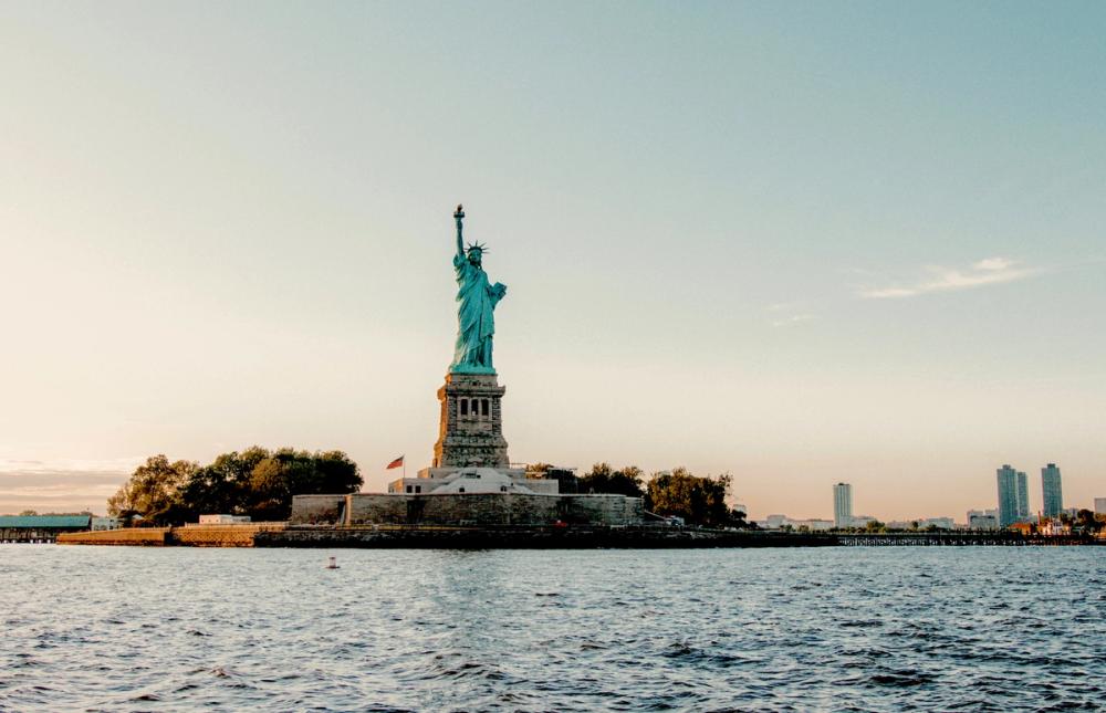 photo of the Statue of Liberty at sunset