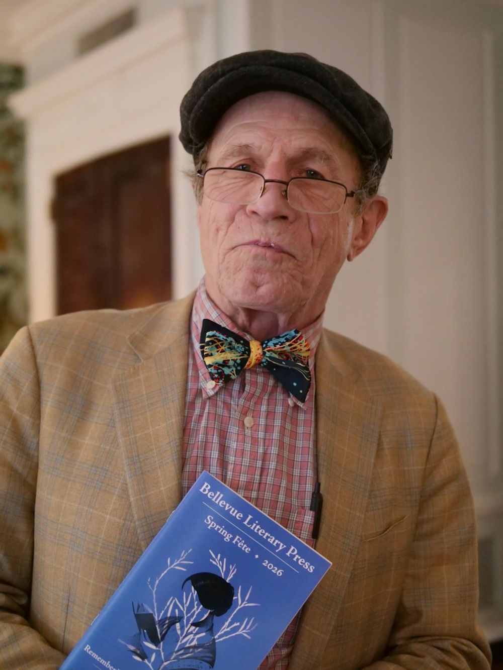 photo of Gerry Ohrstrom holding a fête program