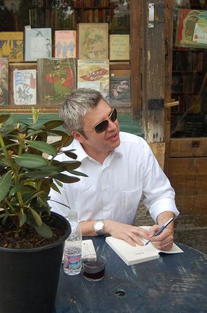portrait of Paul Harding signing Tinkers