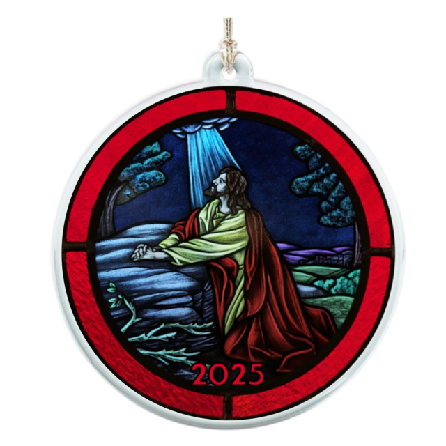 Round acrylic ornament with a red border, printed with a stained glass style scene of a kneeling figure in prayer and the year 2025, on a gold hanging cord