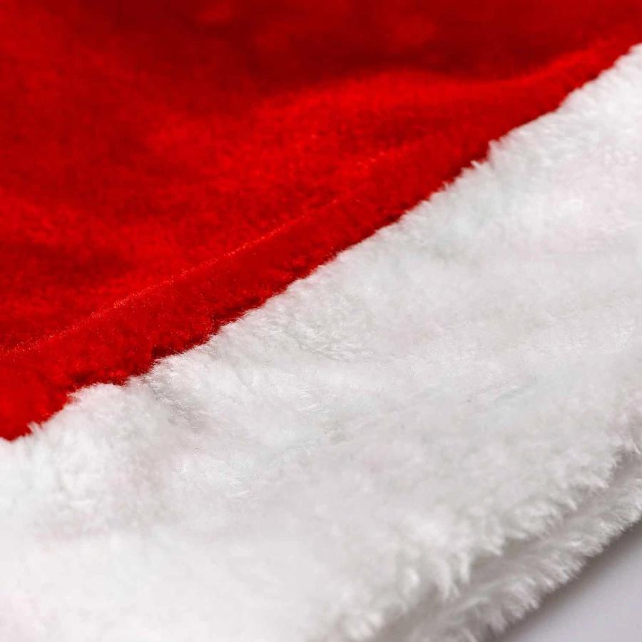 Closeup of Plush Red Santa Hats in Bulk