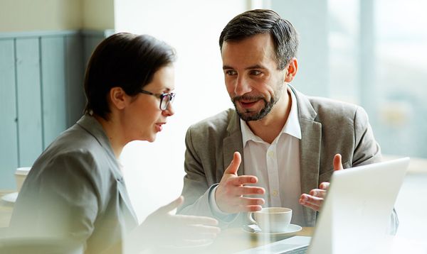 Business owner discussing IT needs during discovery call