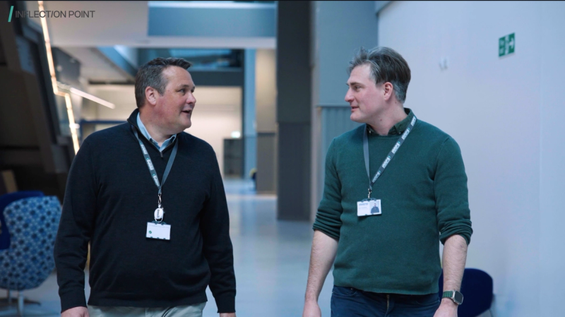 An Inflection Point director walking and talking with a client in the office