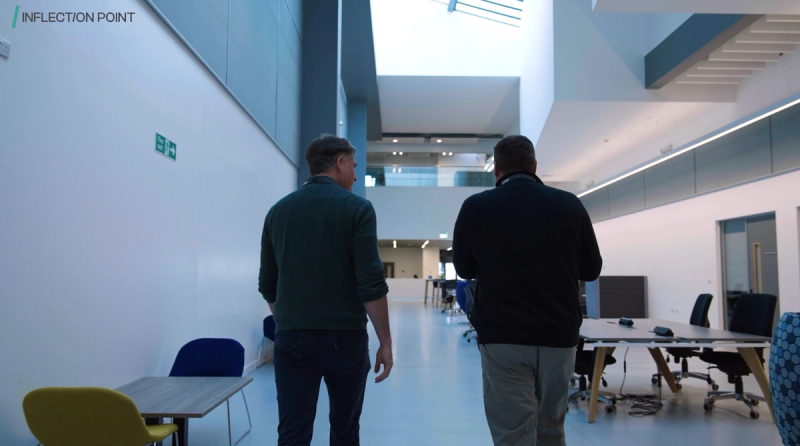 An Inflection Point director walking through the office with a client