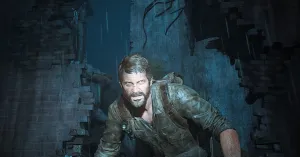 Joel is crouched down in a broken section of a wall, lit by a flashlight shining in his face, gritting his teeth in an angry glare towards the FEDRA officer off-screen who has spotted him.