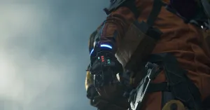 A low shot looking up at Sam’s hand wearing a gravity glove, its digital indicators and lights visible against an empty, moody sky.