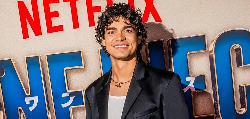 Iñaki Godoy smiling confidently, the talented actor behind the lead role in the One Piece live-action series.
