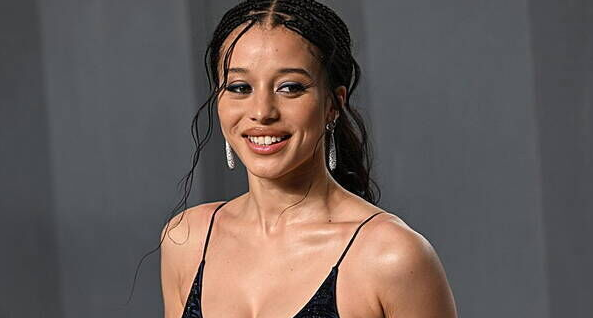 Chase Infiniti smiling on the red carpet during the 2026 Met Gala in her custom designer gown.