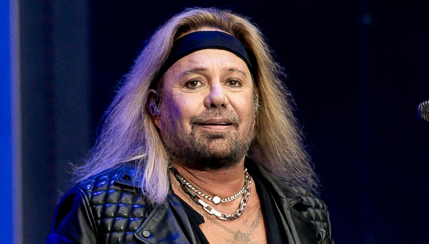 Vince Neil performing live on stage with Mötley Crüe
