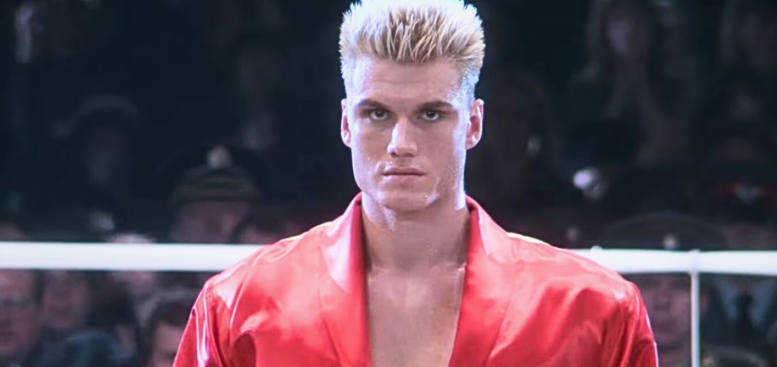 A tall and muscular Dolph Lundgren training in a boxing ring for his role as Ivan Drago in Rocky IV.