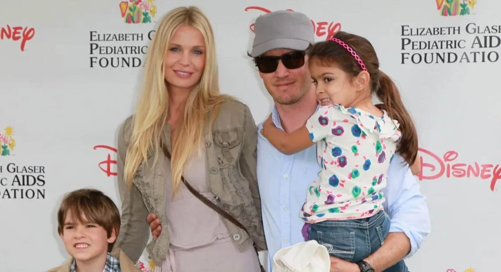 Young Michael Charles Gosselaar standing with his father Mark-Paul Gosselaar at a public family event