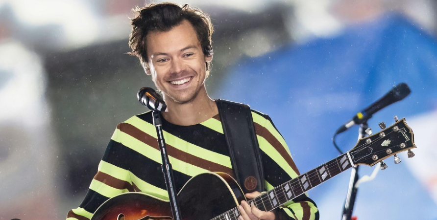 Harry Styles performing on stage during a live concert
