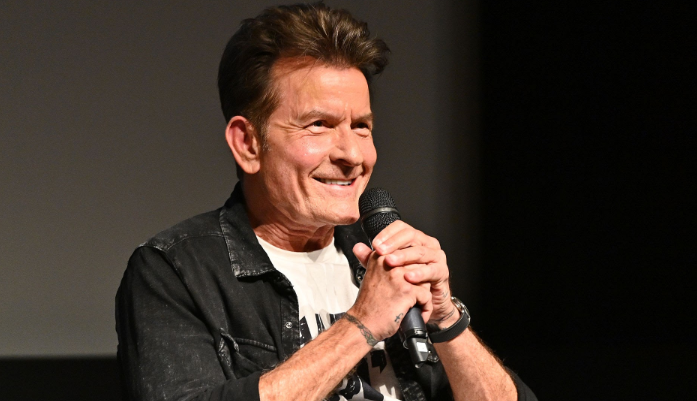 Charlie Sheen posing on a professional film set during his early Hollywood acting career.