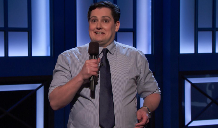 Joe Machi performing stand-up comedy on stage highlighting Joe Machi net worth journey