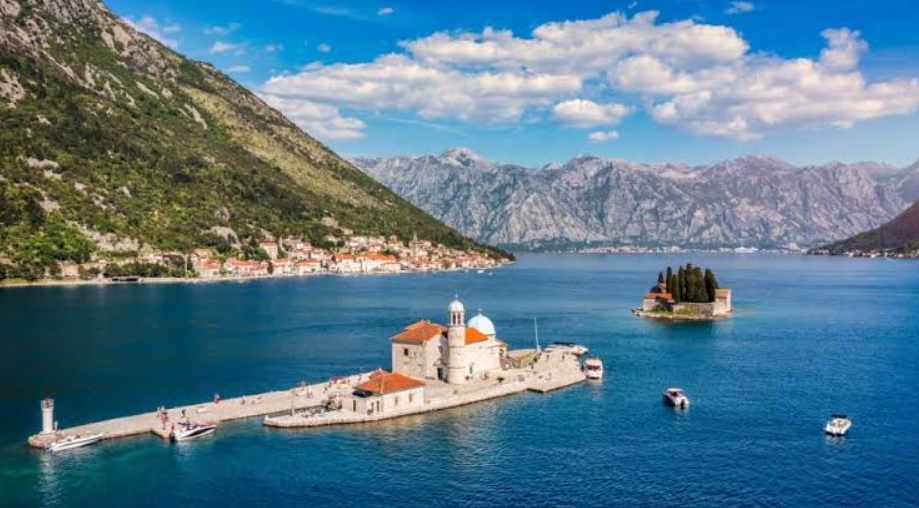 Scenic view of Kotora Melnkalne Old Town with ancient stone streets, historic buildings, and the Adriatic Sea surrounded by mountains