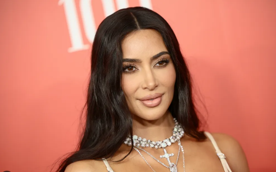 Kim Kardashian attending a public event showcasing her career, fashion influence, and business success.