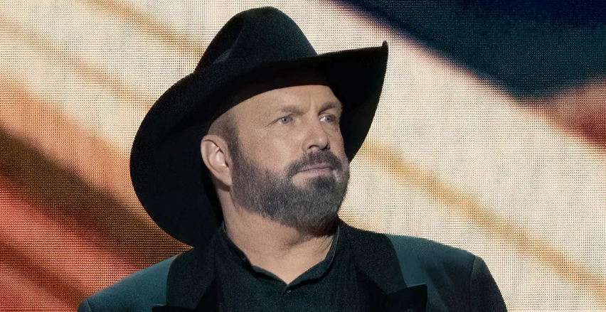 Garth Brooks performing live on stage during a concert