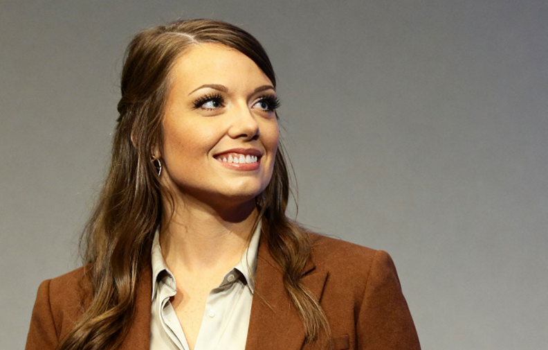 A simple and elegant portrait of Taelyn Dobson smiling naturally