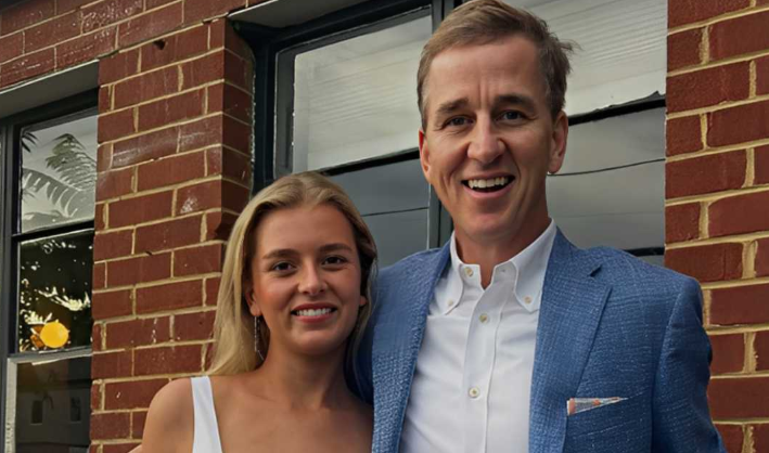 Ellen Heidingsfelder smiling while attending a public event with her husband, Cooper Manning.